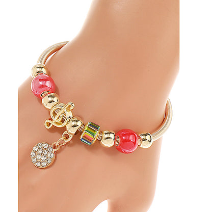 JAB43810 - Rhinestone Circle Treble Clef Charm Bracelet