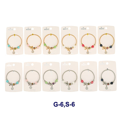 JAB43810 - Rhinestone Circle Treble Clef Charm Bracelet