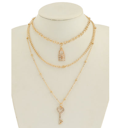 JAN45329 - Rhinestone Key & Locket Layered Chain Necklace